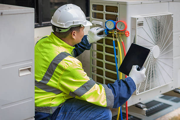 Professional Air Conditioning Repair technician working in Greenville, MI